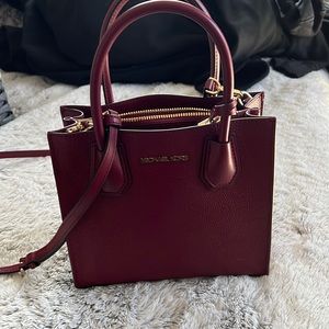 Michael kors bag. Burgundy.  Never used. Measures 9x8x3 without handles
